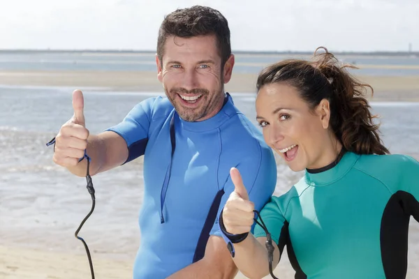 Successful Couple Surfers Show Thumbs — Stock Photo, Image