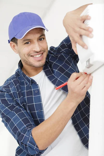 Man Builder Installing Devices Indoors — Stock Photo, Image