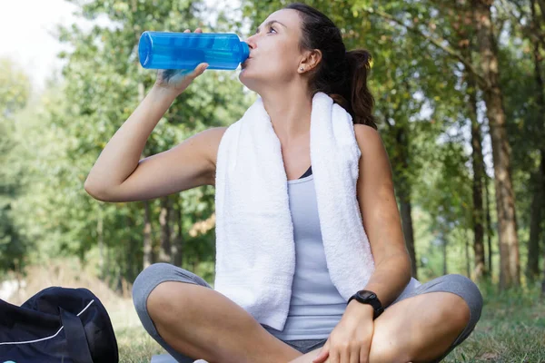 woman drink water from bottle and sport outdoors healthy lifestyle