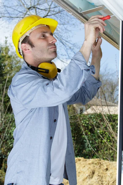 Man Screwing Corner Joint Brace — Stock Photo, Image