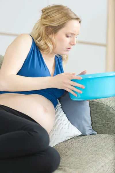Nauseous Pregnant Woman Sofa Holding Plastic Bowl — Stock Photo, Image
