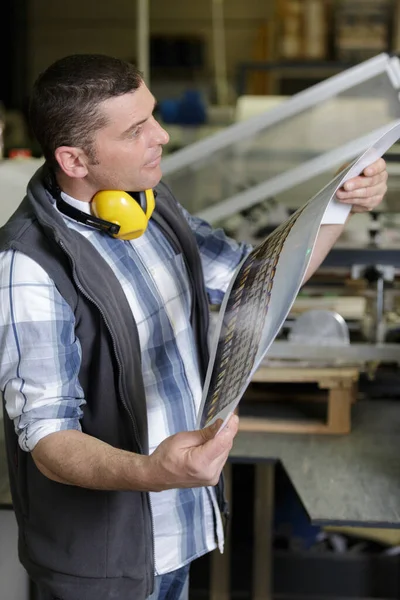 Man Checking Printing Quality — Stock Photo, Image