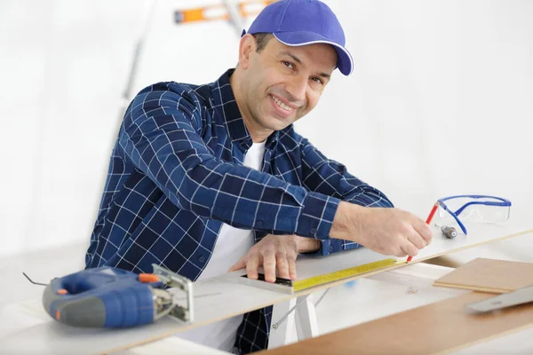 Happy Carpenter Taking Measurement Wooden Plank — Stock Fotó