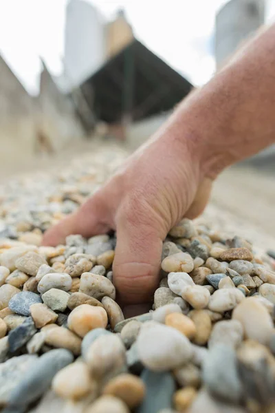 Worker Hand Holding Pebbles — Stock Photo, Image