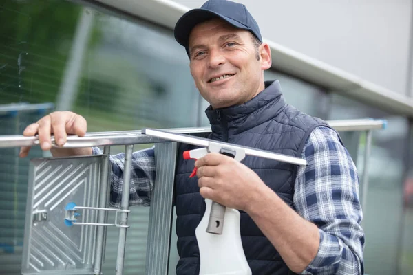 Window Cleaner Holding Ladder Smiling — Stockfoto