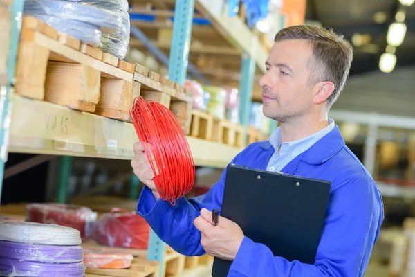 Male Worker Checking Items — Stock Photo, Image