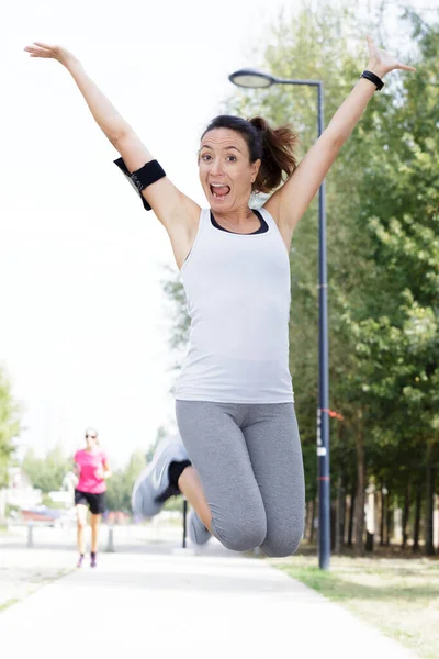 Young Sporty Woman Jumping Outdoors — Stock Photo, Image