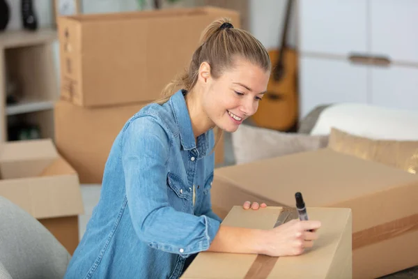 Woman Checking Cardboard Box Moving New Apartment — Stock Photo, Image