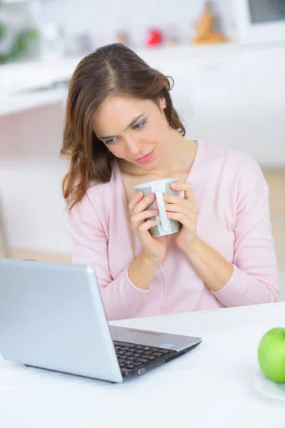 Relaxed Woman Home Holding Cup Looking Laptop — Stock Photo, Image