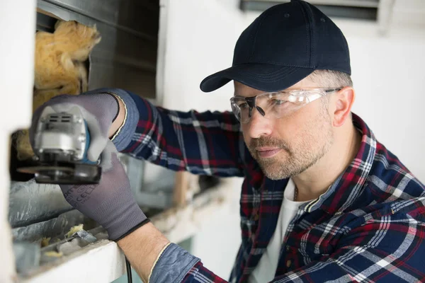 Man Worker Using Professional Angle Grinder Cutting Wall — Stock Photo, Image