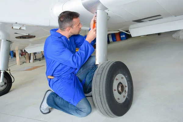Mechanic Working Aircraft Landing Gear — Stock Photo, Image