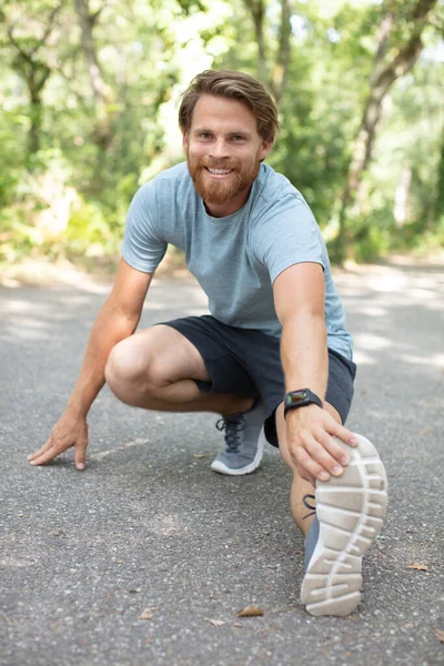 Handsome Man Sports Uniform Stretching Outdoors — Stock Photo, Image
