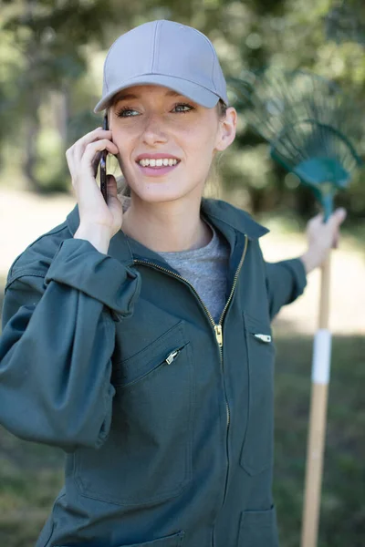 Happy Young Gardener Calling Smartphone — Stock Photo, Image
