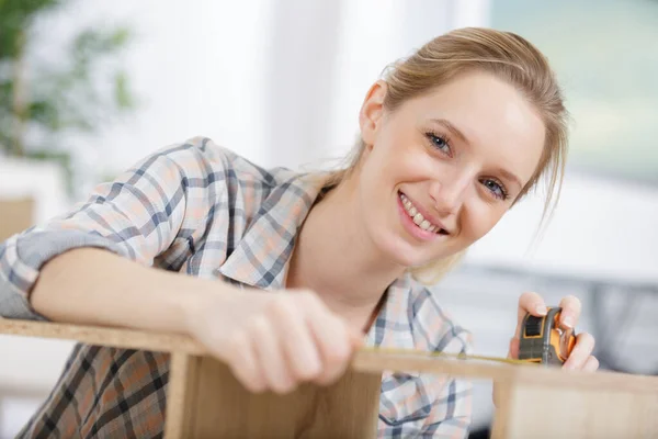 Woman Measuring Furniture Tape Measure White Background — Stock Photo, Image