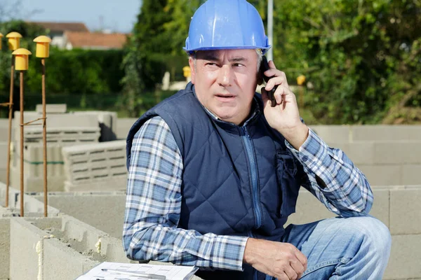 Builder Phoning Architect Check Plans — Stock Photo, Image
