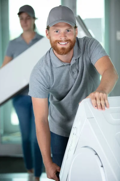 Two Young Male Professional Movers Uniform Delivery Washing Machine — Stock Photo, Image