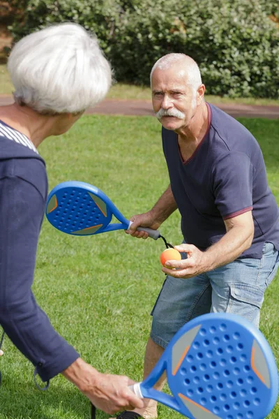 Mature Couple Playing Tennis — Stock Photo, Image