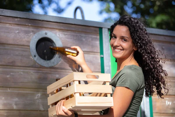 Young Woman Putting Glass Bottle Recycling Container — Stock Photo, Image
