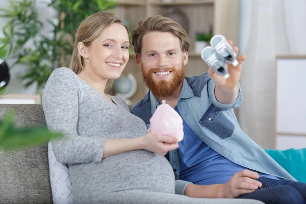 Pregnant Couple Holding Baby Gifts — Stock Photo, Image