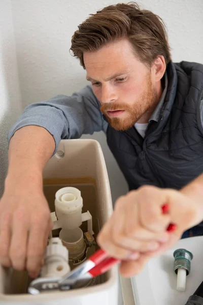 Plumber Assembles Installs Toilet — Stock Photo, Image