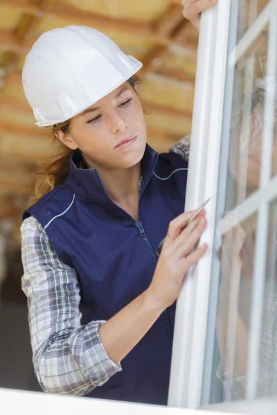 Woman Builder Unscrews Fastening Screws Handle Window Using Screwdriver — Stock Photo, Image