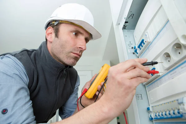 Electrician Checking Voltage Fuse Board Royalty Free Stock Images