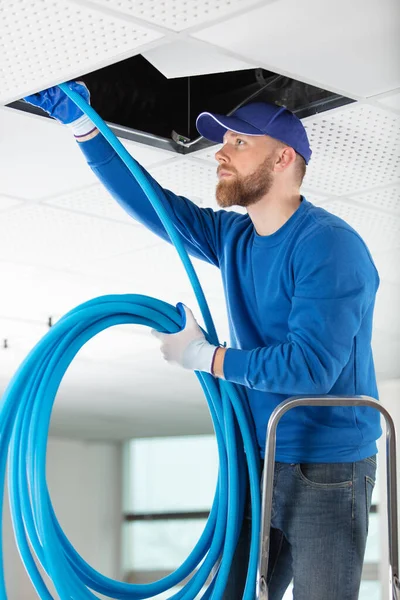 Worker Installing Stretch Ceiling Empty Room — Stock Photo, Image
