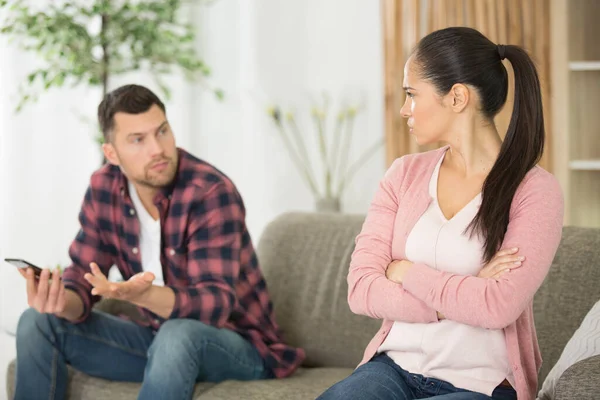 Couple Sitting Together Couch Home Upset Look — Stock Photo, Image
