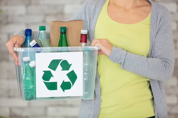 young woman to recycle and reuse