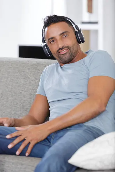 happy casual man in headphones alone