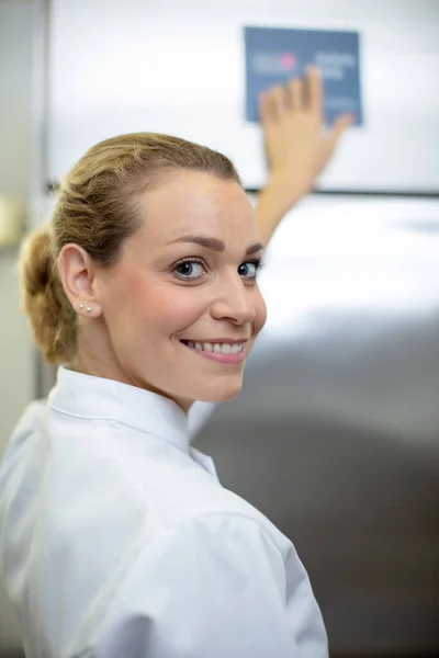young woman with cooks uniform a