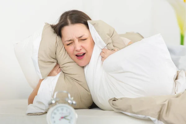 Woman Shouting Covering Ears Pillow Due Alarm — Stock Photo, Image