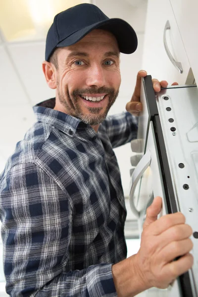 Man Installing Oven Kitchen Furniture — Stock Photo, Image