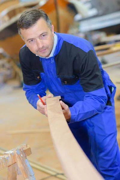 Carpenter Holding Angled Wood — Stock Photo, Image