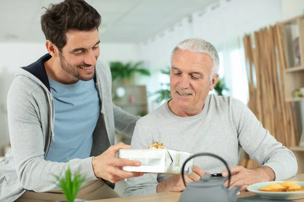 Nice Elderly Father Receive Present His Grown Son — Stock Photo, Image
