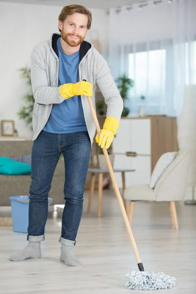 Cheerful Young Man Mopping Floor Home — Stock Photo, Image
