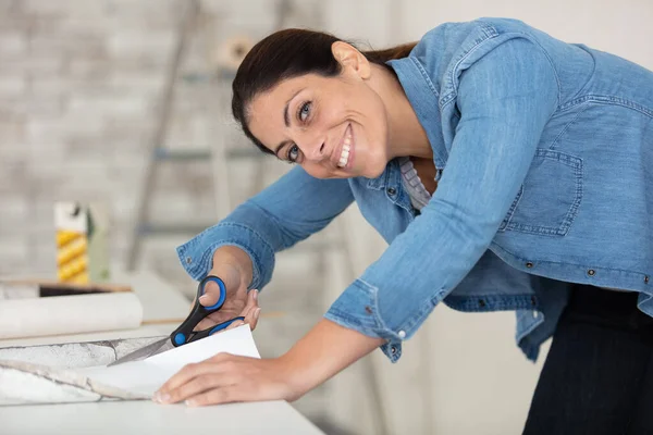 Woman Sitting Wallpaper Rolls Renovation — Stock Photo, Image