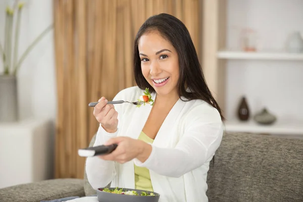 Smiling Young Woman Eating Salad Watching Home — Stock Photo, Image