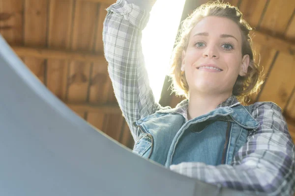 stock image happy female carpenter working in workshop