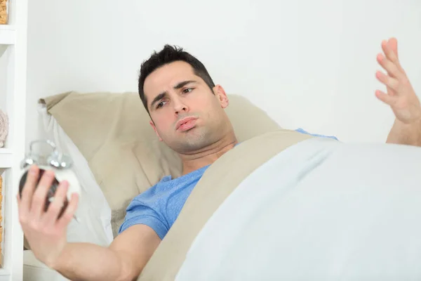 Tired Man Bed Happy Alarm Clock — Stock Photo, Image