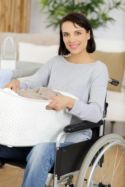 Woman Wheelchair Doing Laundry — Stock Photo, Image