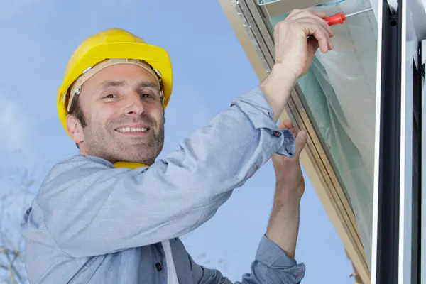 Happy Builder Installing Window Outdoors — Stock Photo, Image