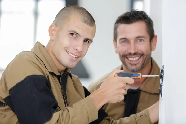 Two Mans Assembling Furniture Floor Apartment — Stock Photo, Image