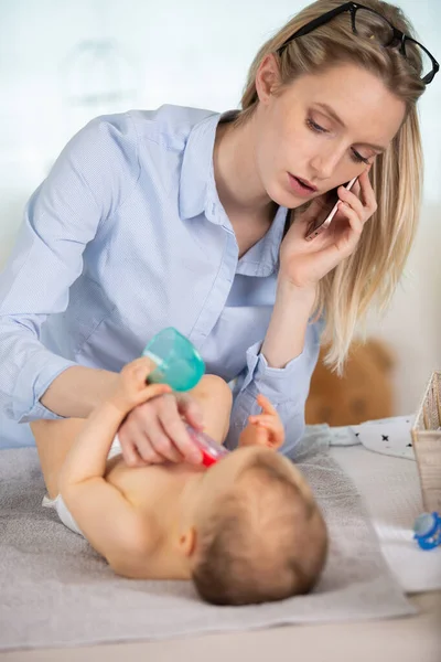 Woman Taking Temperature Her Baby Calling Doctor — Stock Photo, Image