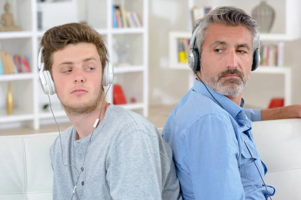 Father Son Wearing Headphones Sitting Back Back — Stock Photo, Image