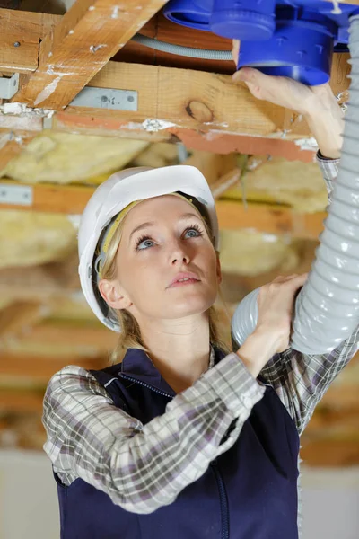 Young Female Worker Installing Ventilation System — Stock Photo, Image