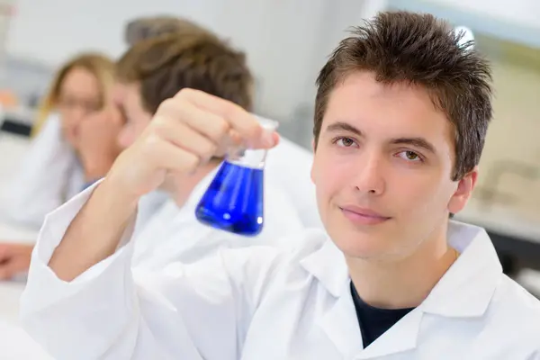 Male Science Student Holding Glass Flask — Stock Photo, Image