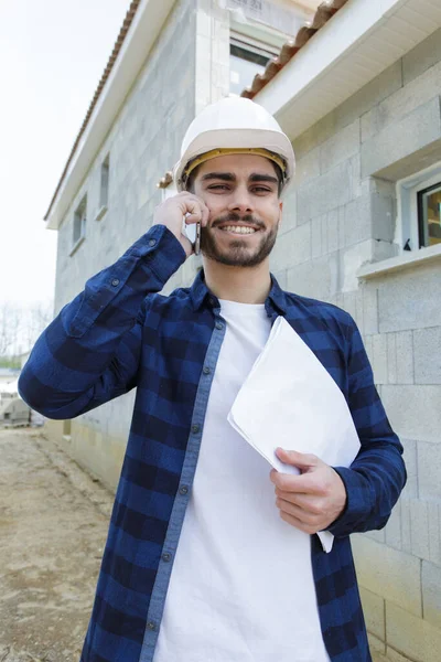 busy construction engineer talking on phone