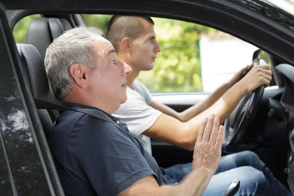 Young Man Passing Driving License Exam Stock Image