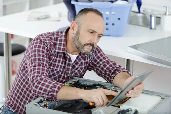 Man Looking Tablet While Trying Repair Washing Machine — Stock Photo, Image
